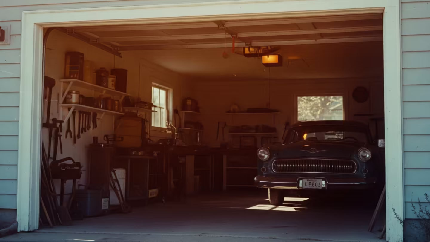 Vintage garage interior with a restored car, evoking the history of garage craftsmanship